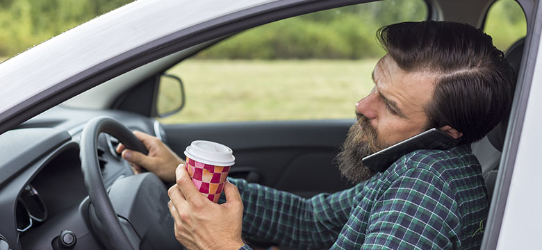 Man-Engaging-in-Distracted-Driving